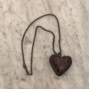 Heart shaped pendant necklace with marble effect.